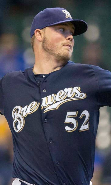 Nelson earns Brewers' first win with shiny new curveball